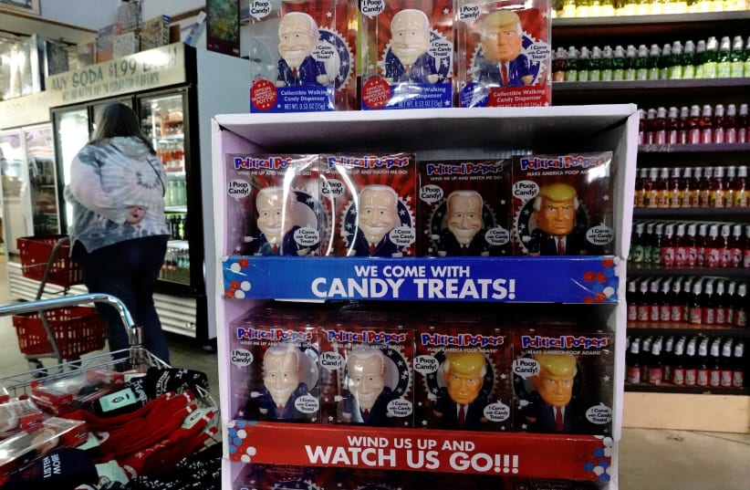 'Political Poopers' toys depicting US President Donald Trump and Democratic presidential candidate Joe Biden are seen inside Minnesota's Largest Candy Store in Jordan, Minnesota, US, October 24, 2020. (photo credit: REUTERS/BING GUAN)