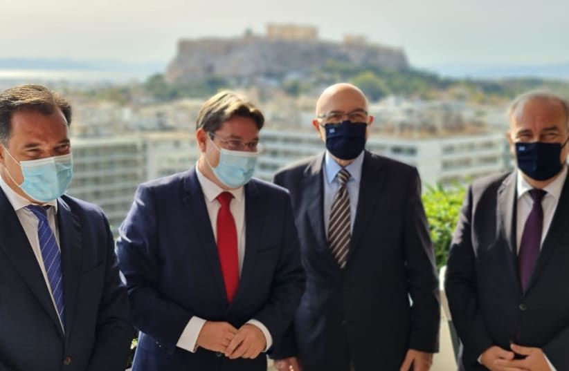 Regional Cooperation Minister Ofir Akunis meets with his Greek counterpart Development and Investment Minister Adonis Georgiadis in Athens, October 26, 2020. (photo credit: SPOKESPERSONS OFFICE FOR OFIR AKUNIS)