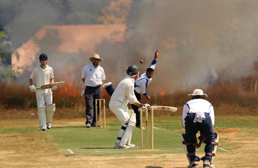 A cricket match in Lod in 2012. Cricket was introduced in Israel by the British during the Mandate period  (photo credit: DAVID HARRIS)