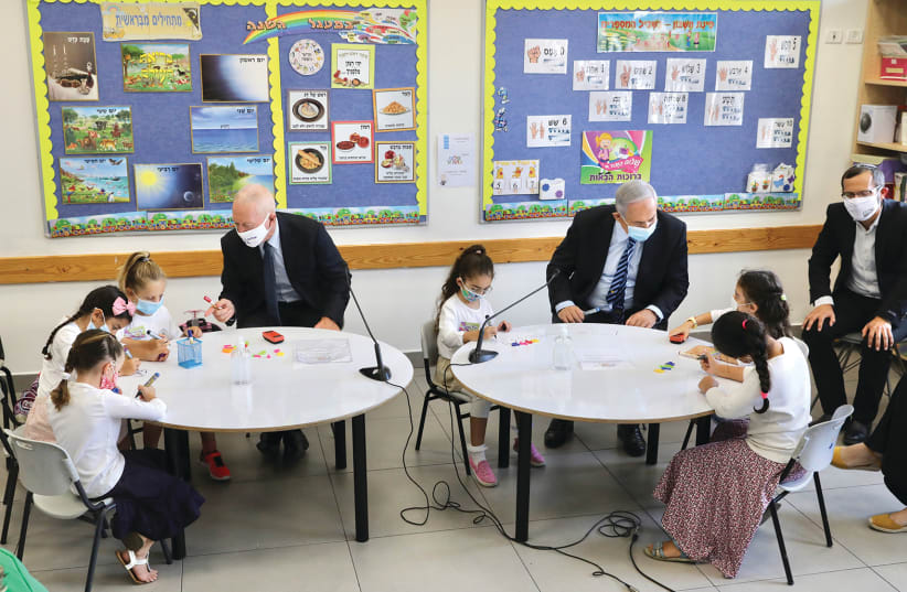 Prime Minister Benjamin Netanyahu and Education Minister Yoav Gallant visit a class at the opening of the 2020-2021 school year at the Netaim primary school in Mevo Horon on September 1 (photo credit: MARC ISRAEL SELLEM)