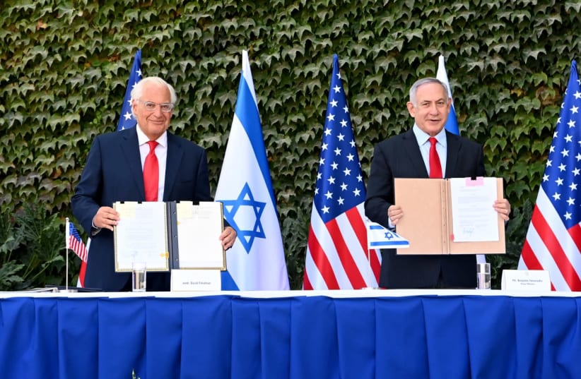 US Ambassador to Israel David Friedman and Prime Minister Benjamin Netanyahu at a ceremony signing new versions of three agreements on research cooperation, Ariel University, October 28, 2020 (photo credit: MATTY STERN/US EMBASSY JERUSALEM)