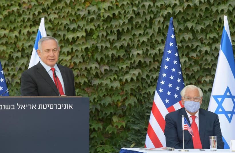 Prime Minister Benjamin Netanyahu and US Ambassador to Israel David Friedman are seen at a ceremony at Ariel University. (photo credit: AMOS BEN-GERSHOM/GPO)