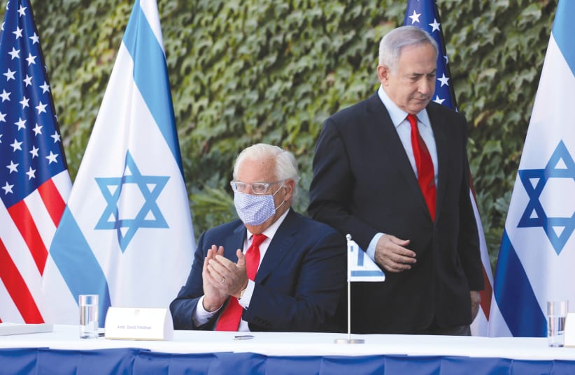 PRIME MINISTER Benjamin Netanyahu and US Ambassador to Israel David Friedman attend Wednesday’s ceremony in Ariel that extended Israel-US scientific cooperation agreement in West Bank and Golan Heights. (photo credit: EMIL SALMAN/REUTERS)