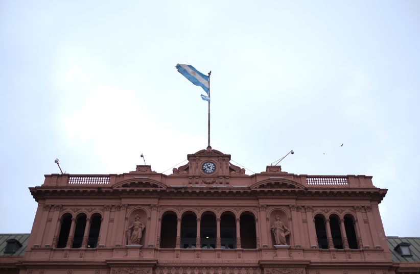 An Argentinian flag waves at the Presidential Palace Casa Rosada in Buenos Aires, Argentina October 29, 2019. (photo credit: REUTERS/CARLOS GARCIA RAWLINS)