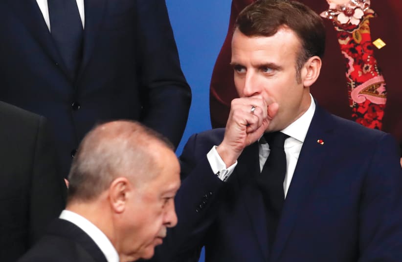 TURKISH PRESIDENT Recep Tayyip Erdogan called French President Emmanuel Macron’s mental health into question in response to the French president’s campaign to maintain secular values following the beheading of a teacher.  (photo credit: CHRISTIAN HARTMANN/REUTERS)