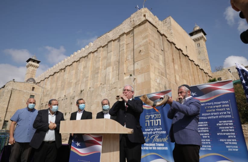 Settlers pray for a Trump victory and blow the shofar outside the Tomb of the Patriarchs in Hebron, November 2, 2020 (photo credit: MOUNT HEBRON REGIONAL COUNCIL SPOKESPERSON'S OFFICE)