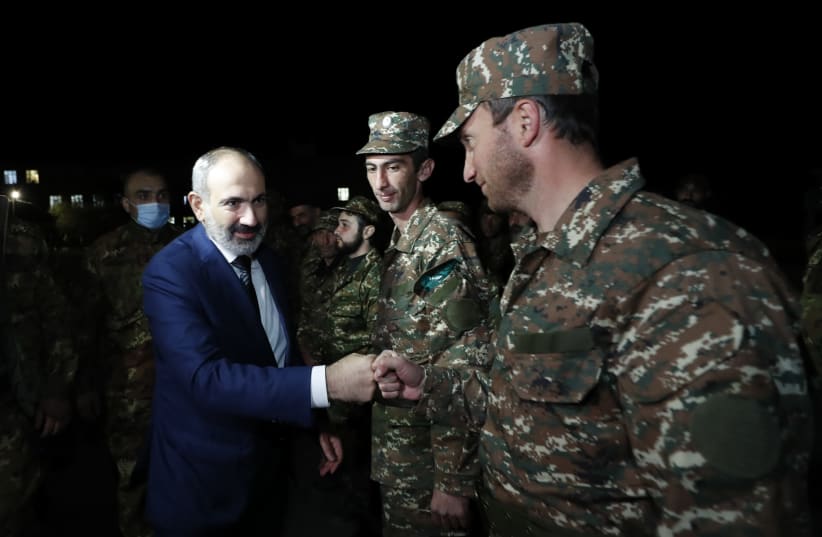 Armenian Prime Minister Nikol Pashinyan greets reservists at the Defence Ministry's base before their departure for the breakaway region of Nagorno-Karabakh in Yerevan, Armenia, October 16, 2020. (photo credit: ARMENIAN PRIME MINISTER PRESS SERVICE/TIGRAN MEHRABYAN/PAN PHOTO VIA REUTERS)
