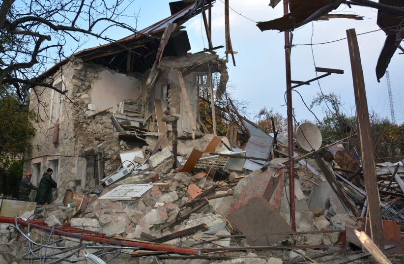 A view shows what is said to be the aftermath of recent shelling in the city of Stepanakert during a military conflict over the breakaway region of Nagorno-Karabakh, November 6, 2020 (photo credit: ARMENIAN UNIFIED INFOCENTRE/HANDOUT VIA REUTERS)