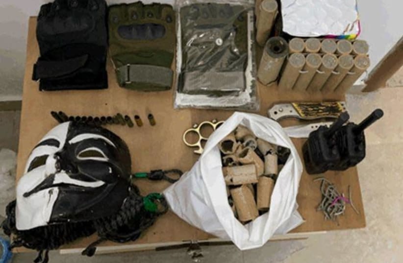 Weapons, ammunition, uniforms and money in order to carry out attacks in the West Bank confiscated by the Shin Bet (photo credit: SHIN BET)