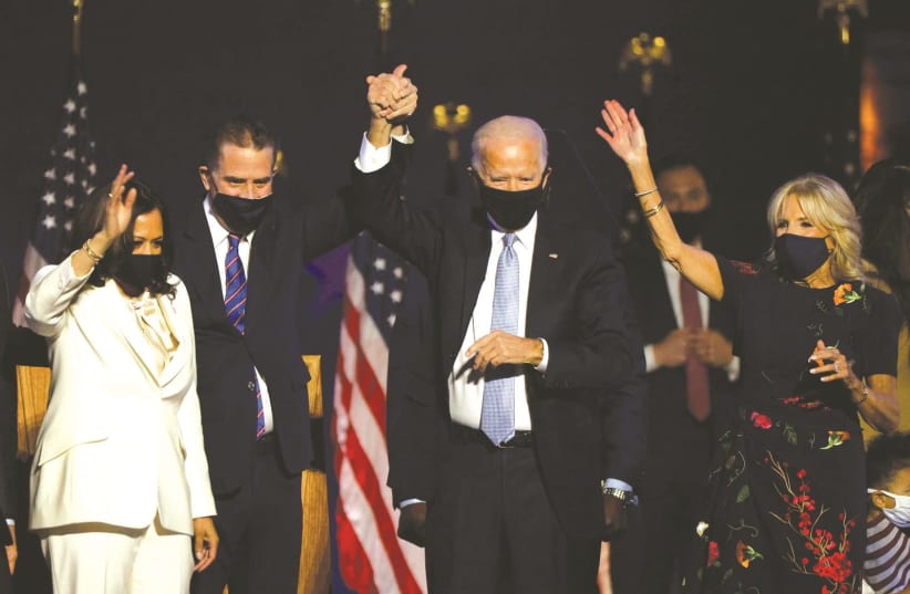 US President-elect Joe Biden, his wife, Jill, his son Hunter Biden and Vice President-elect Kamala Harris celebrate at their election rally in Wilmington, Delaware, on November 7 (photo credit: JIM BOURG / REUTERS)