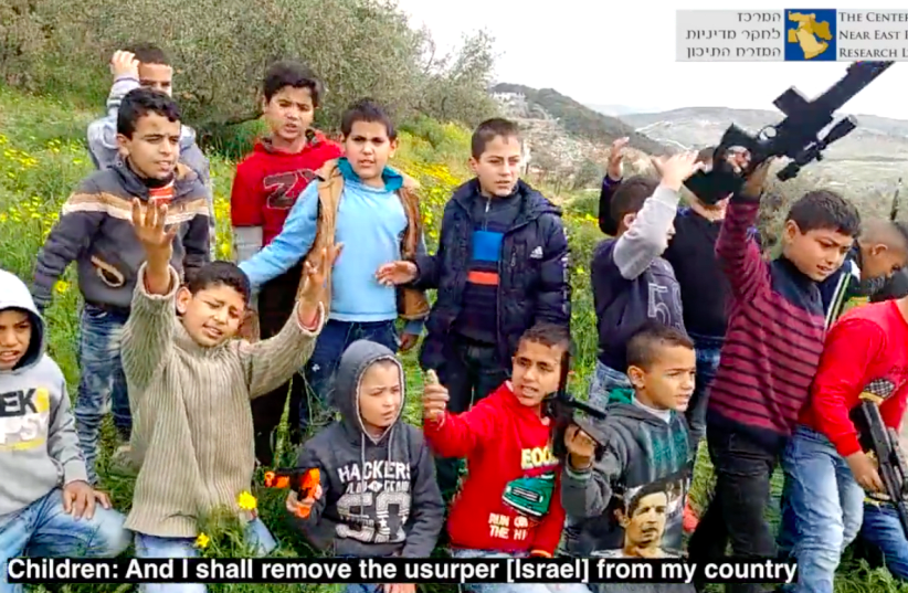 Children from an UNRWA school near Bethlehem chant from an UNRWA third grade text which praises the expulsion of ‘the Zionists’  (photo credit: screenshot)