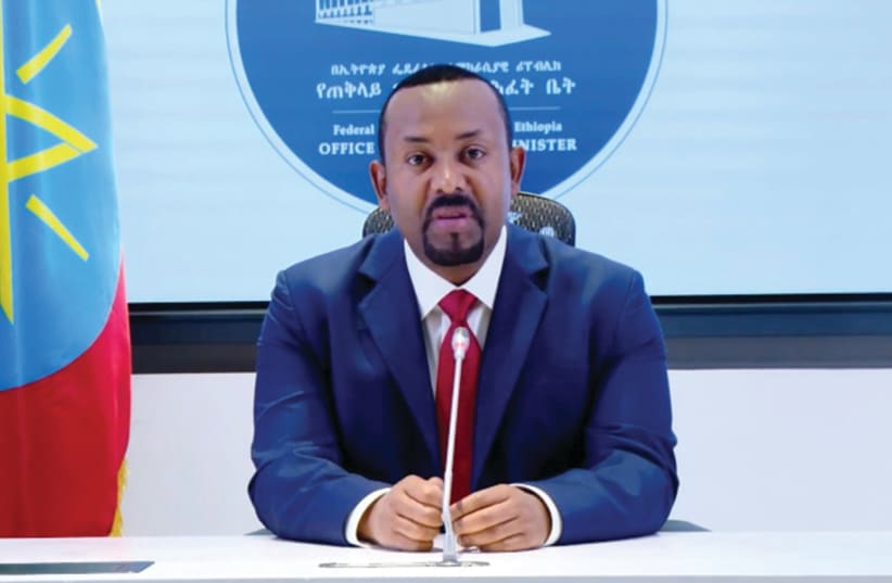 ETHIOPIAN PRIME Minister Abiy Ahmed speaks from Addis Ababa in a video posted on his Facebook page on Sunday. (photo credit: SCREENSHOT/REUTERS)