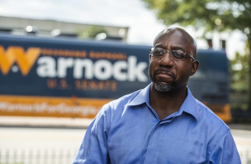 Rev. Raphael Warnock seen after a campaign rally in LaGrange, Ga., Oct. 29, 2020. (photo credit: TOM WILLIAMS/CQ ROLL CALL/GETTY IMAGES/JTA)