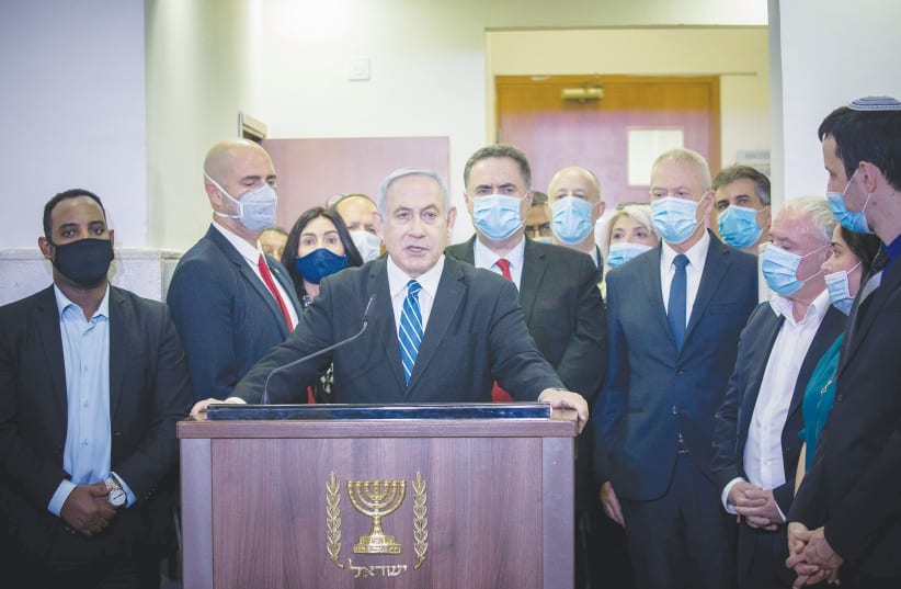 PRIME MINISTER Benjamin Netanyahu gives a press statement ahead of the start of his trial at the District Court in Jerusalem in May. (photo credit: YONATAN SINDEL/FLASH 90)