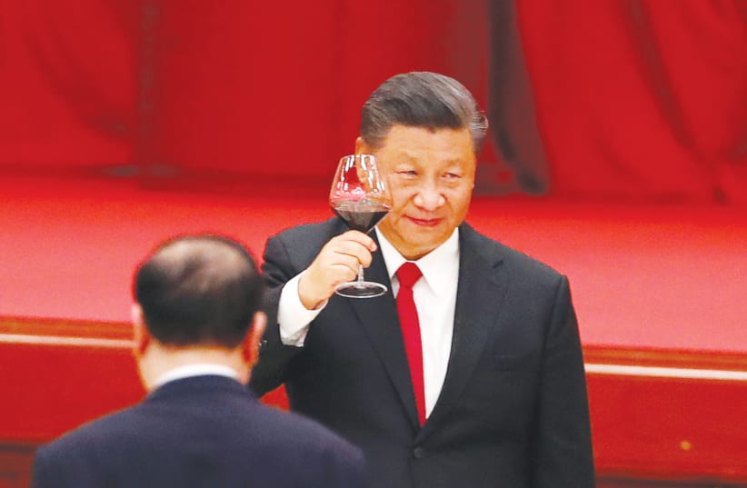 CHINESE PRESIDENT Xi Jinping makes a toast on the eve of the 71st anniversary of the founding of the People’s Republic of China, in Beijing on September 30.  (photo credit: REUTERS)