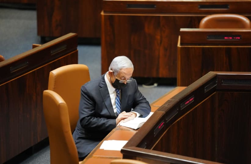 Prime Minister Benjamin Netanyahu attends a Knesset vote on a bill that would prevent anyone under criminal indictment from serving as prime minister, November 18, 2020 (photo credit: KNESSET SPOKESPERSON/DANI SHEM TOV)