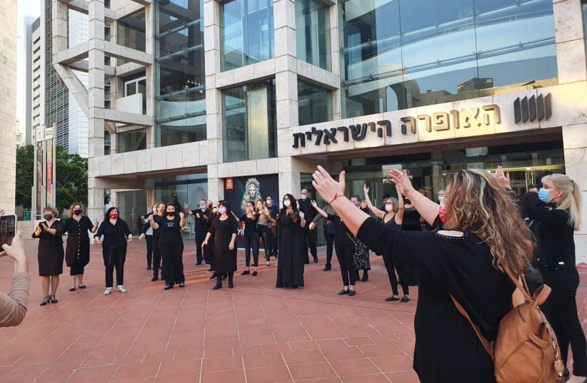 Singers from the opera chorus outside the Israeli Opera in Tel Aviv Wednesday (photo credit: Courtesy)