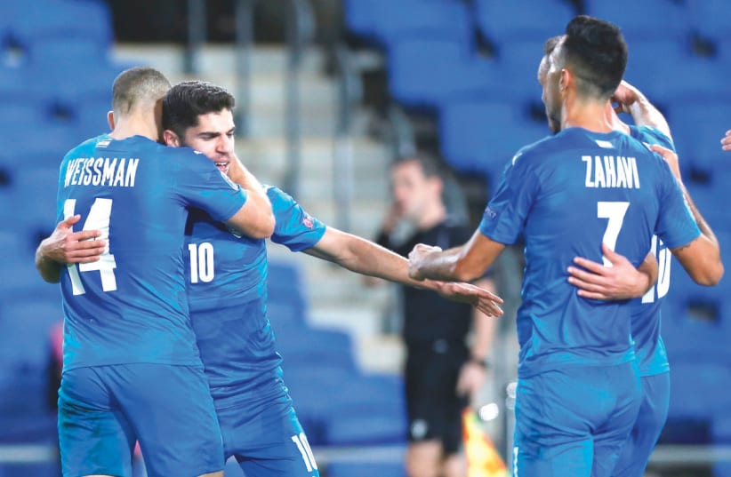 ISRAEL FORWARD Manor Solomon (10) celebrates with his teammates after scoring for the blue-and-white in its 1-0 victory over Scotland in the Nations League action on Wednesday night in Netanya. (photo credit: AMIR COHEN/REUTERS)