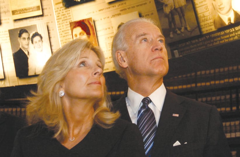 Then-vice president Joe Biden and his wife, Jill, visit the Hall of Names at Yad Vashem on March 9, 2010. Quoting the Irish poet, William Butler Yeats, Biden wrote in the visitors’ book: ‘Every day Israel makes a lie of the poet’s words – too long a suffering makes a stone of the heart. (photo credit: RONEN ZVULUN / REUTERS)