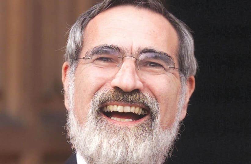 Chief Rabbi Jonathan Sacks at Lambeth Palace in 2001 after being honored as a doctor of divinity in recognition of his leadership in the Jewish community and his contribution to inter-faith relations (photo credit: REUTERS)