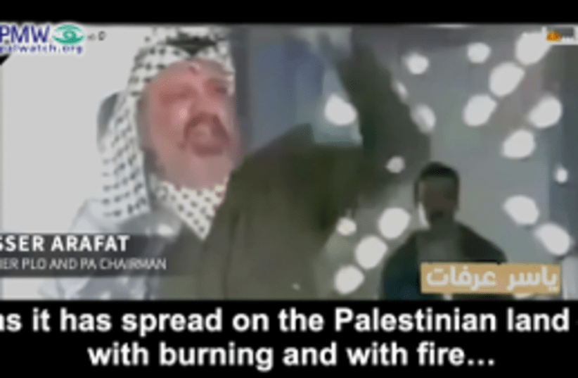 Former PLO/PA Chairman Yasser Arafat: "this blood will spread on the land as it has spread on the Palestinian land – with burning and with fire," Official PA TV, November 10-11.  (photo credit: PALESTINIAN MEDIA WATCH)