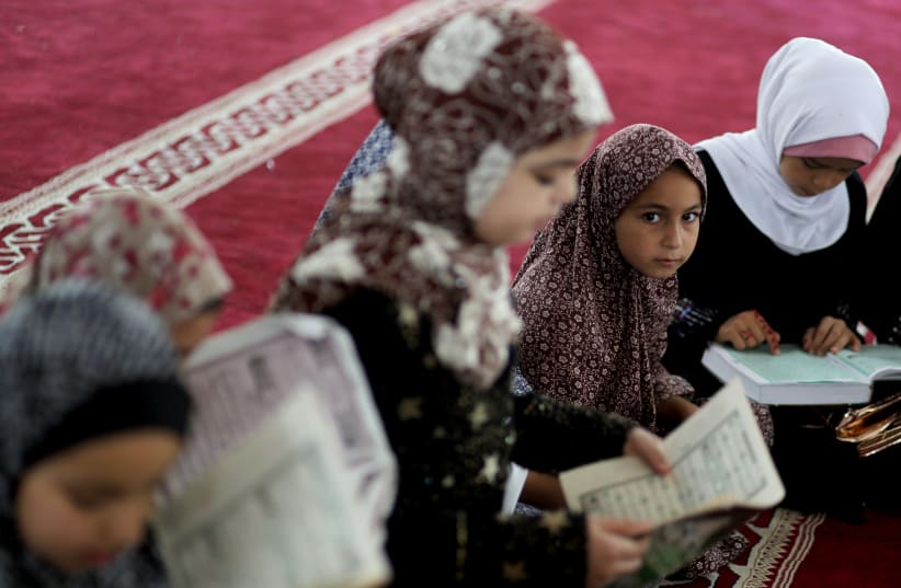 Palestinian children learn Islamic lessons on summer vacation as COVID-19 restrictions ease in Gaza. (photo credit: MOHAMMED SALEM/ REUTERS)
