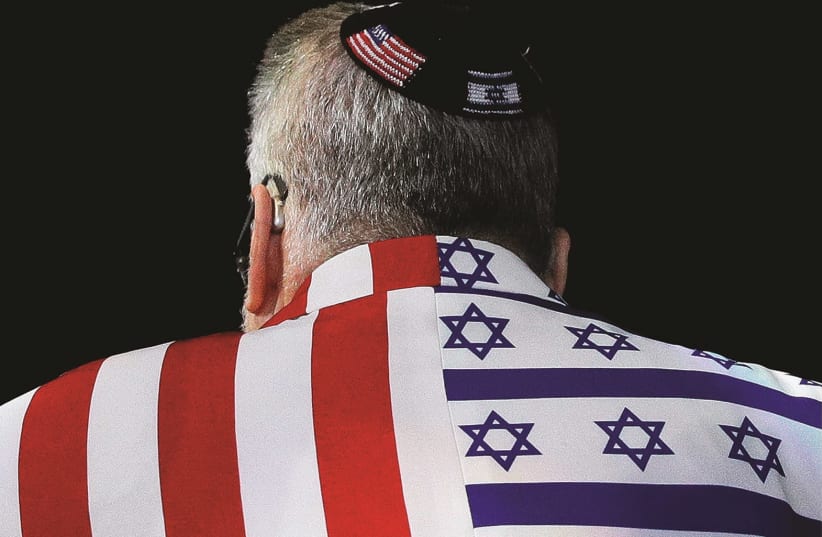 An AIPAC attendee sports a US-Israel themed suit (photo credit: TOM BRENNER/REUTERS)