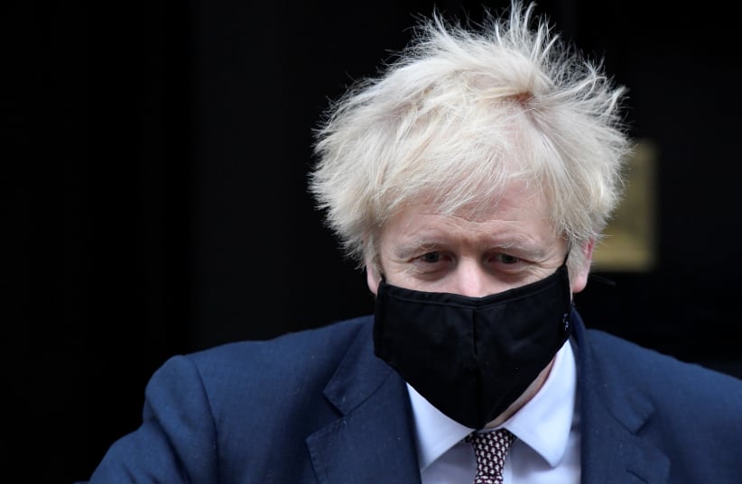 Britain's Prime Minister Boris Johnson seen in public for the first time since his self-isolation ended, leaves Downing Street during the coronavirus disease (COVID-19) outbreak in London, Britain, November 26, 2020. (photo credit: REUTERS/TOBY MELVILLE)