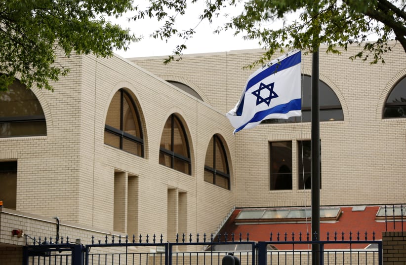 Israeli flag flies at the Israeli Embassy in Washington (photo credit: REUTERS/GARY CAMERON)