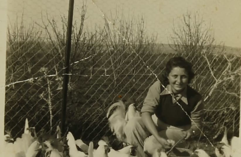 Hannah Senesh is seen with chickens on Moshav Nahalal. (photo credit: COURTESY OF THE NATIONAL LIBRARY OF ISRAEL'S HANNAH SENESH ARCHIVAL COLLECTION)