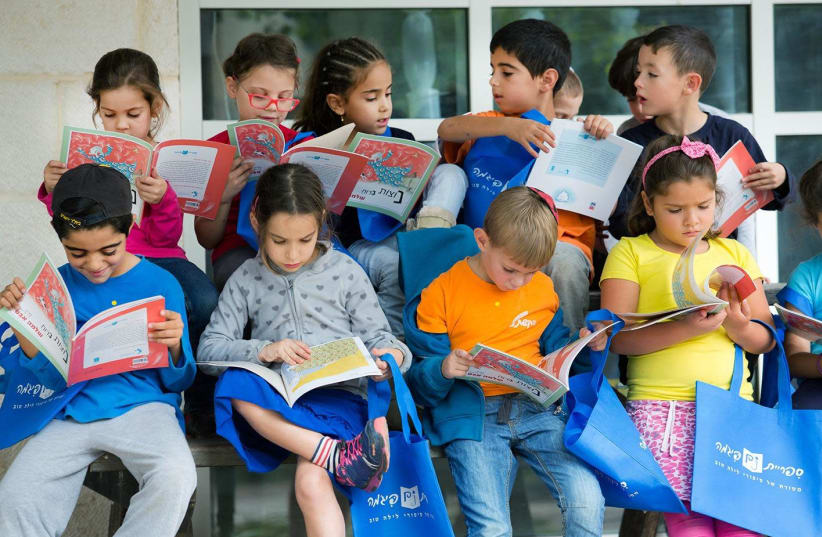 KGI's largest initiative, Sifriyat Pijama, which runs in partnership with the Education Ministry, works towards improving and promoting literacy across the world. (photo credit: KEREN GRINSPOON ISRAEL)