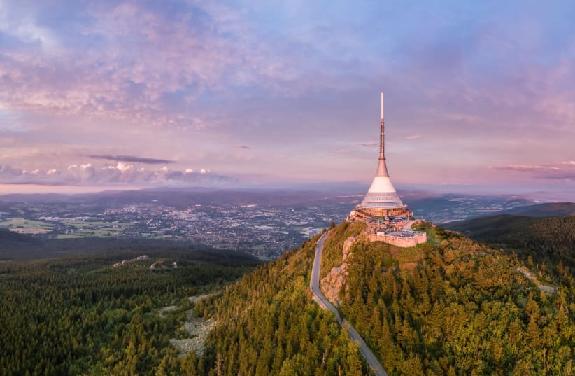 Mount Jestě ̌d rises above Liberec with a unique hotel and a television transmitter at its top.  (photo credit: UPVISION)
