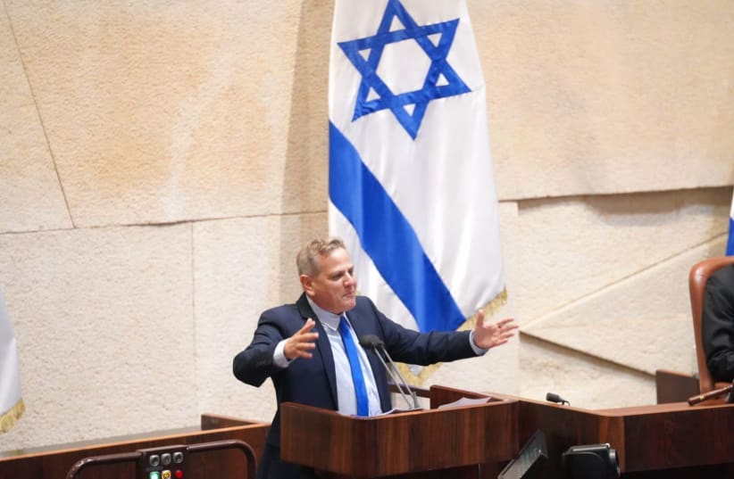 Meretz leader Nitzan Horowitz is seen gesturing at the Knesset plenum amid a vote on dissolving the Knesset, on Decemeber 2, 2020. (photo credit: KNESSET SPOKESPERSON/DANI SHEM TOV)