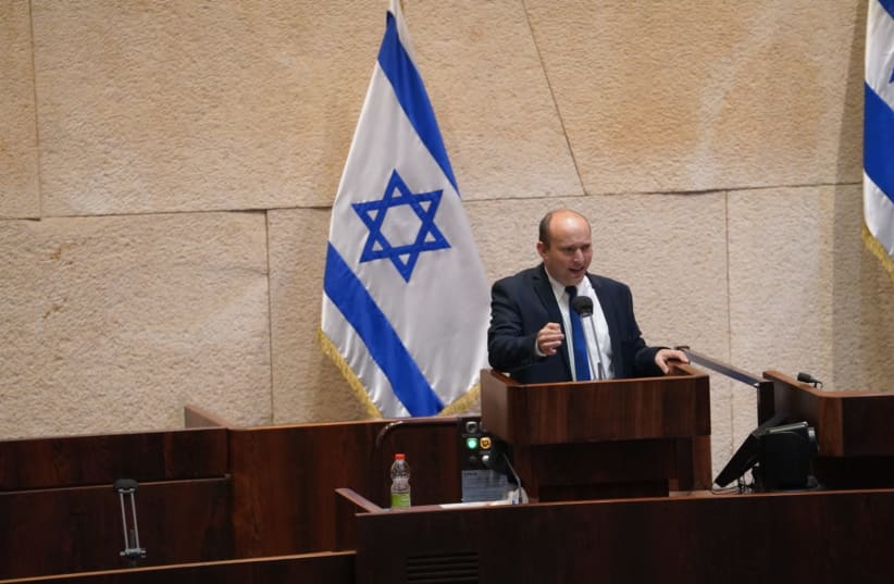 Yamina leader Naftali Bennett is seen speaking during the vote to dissolve the Knesset, on December 2, 2020. (photo credit: KNESSET SPOKESPERSON/DANI SHEM TOV)