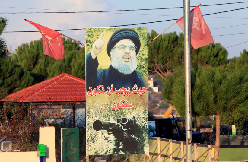 A POSTER of Hezbollah leader Hassan Nasrallah in living color in Nakoura, near the Lebanese-Israeli border, last month. (photo credit: AZIZ TAHER/REUTERS)