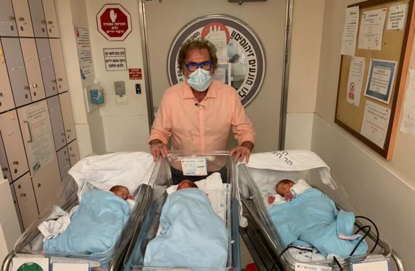 Prof. Simcha Yagel with the three newborn triplets at Hadassah Hospital. (photo credit: HADASSAH SPOKESPERSON)