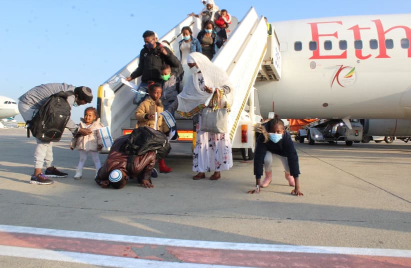 Members of the Falash Mura community from Ethiopia land in Israel as part of the second flight of the Rock of Israel operation. (photo credit: SHIRA AMAN/THE JEWISH AGENCY)