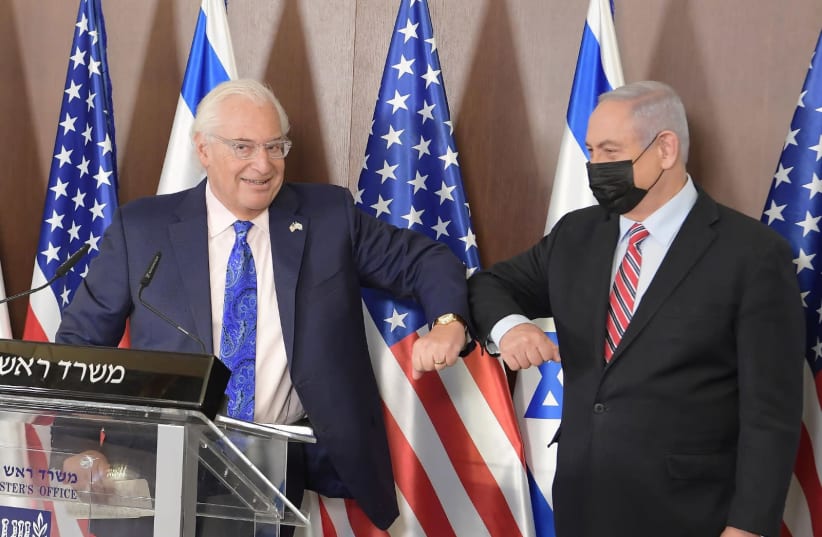 Prime Minister Benjamin Netanyahu and US Ambassador to Israel David Friedman on third anniversary of President Donald Trump's recognition of Jerusalem as Israel's capitol, December 6, 2020. (photo credit: AMOS BEN GERSHOM, GPO)