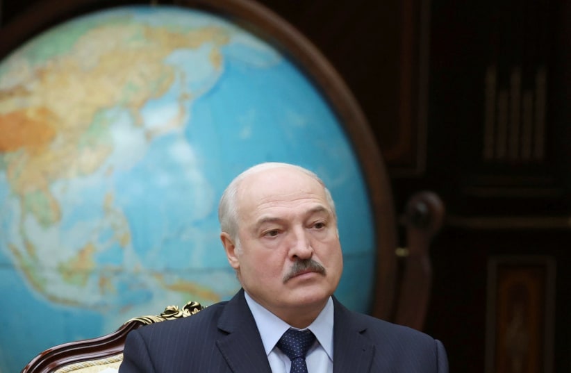 Belarusian President Alexander Lukashenko attends a meeting with Chairman of the Board of the Eurasian Economic Commission Mikhail Myasnikovich in Minsk, Belarus November 30, 2020. (photo credit: MAXIM GUCHEK/BELTA/HANDOUT VIA REUTERS)