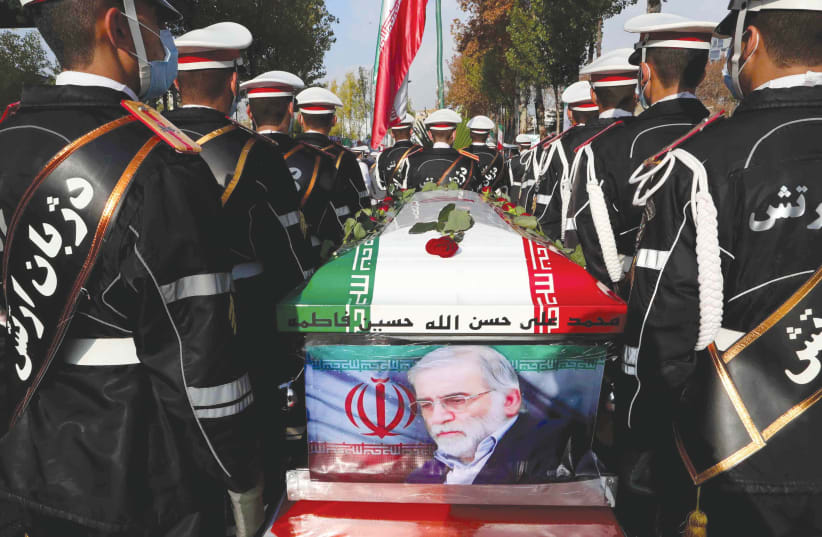 MEMBERS OF Iranian forces carry the coffin of Iranian nuclear scientist Mohsen Fakhrizadeh during a funeral ceremony in Tehran, last month. (photo credit: IRANIAN DEFENSE MINISTRY/REUTERS)