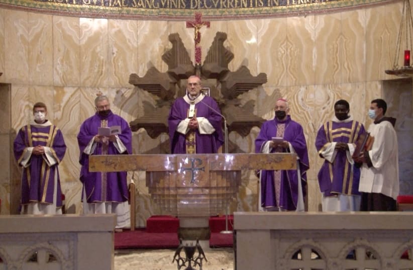 Special Mass in Church of All Nations on Sunday following arson attack on Friday. Latin Patriarch Pierbattista Pizzaballa center. (photo credit: THE CUSTODY OF THE HOLY LAND)