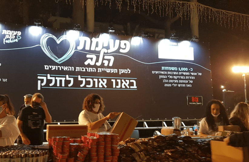 Members of the Heartbeat Association preparing food baskets for culture and events workers in Rabin Square in Tel Aviv on Monday. (photo credit: HEARTBEAT ASSOCIATION)