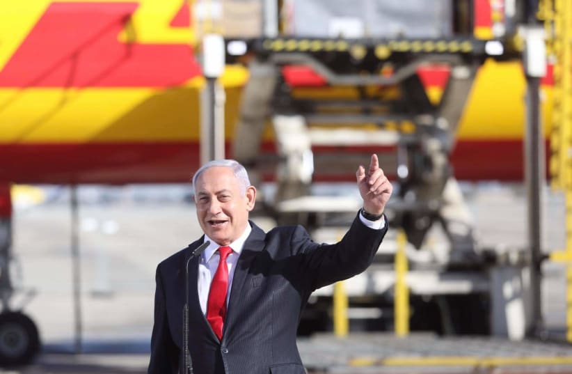Prime Minister Benjamin Netanyahu welcomed the arrival of the first batch of Pfizer coronavirus vaccines in Israel  (photo credit: MARC ISRAEL SELLEM)