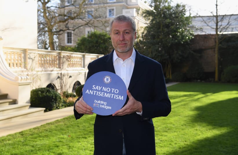 Chelsea Football Club owner Roman Abramovich holding a sign the club's "Say No to Antisemitism" campaign. (photo credit: CHELSEA FC/COURTESY)
