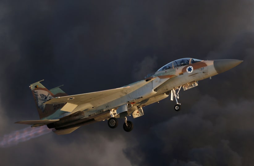 An Israeli Air Force F-15 fighter jet flies during an aerial demonstration at a graduation ceremony for Israeli airforce pilots at the Hatzerim air base in southern Israel June 30, 2016. (photo credit: AMIR COHEN/REUTERS)