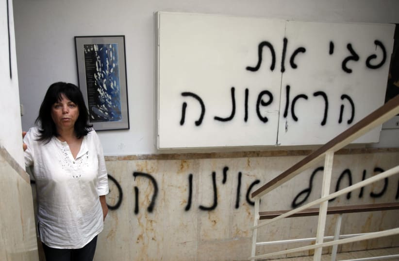 Peggy Cidor stands outside her home in Jerusalem, May 20, 2013. Cidor has made an effort in recent years to bring back Rosh Chodesh el Benat, a holiday she celebrated in Tunisia as a little girl. (photo credit: GALI TIBBON / AFP)
