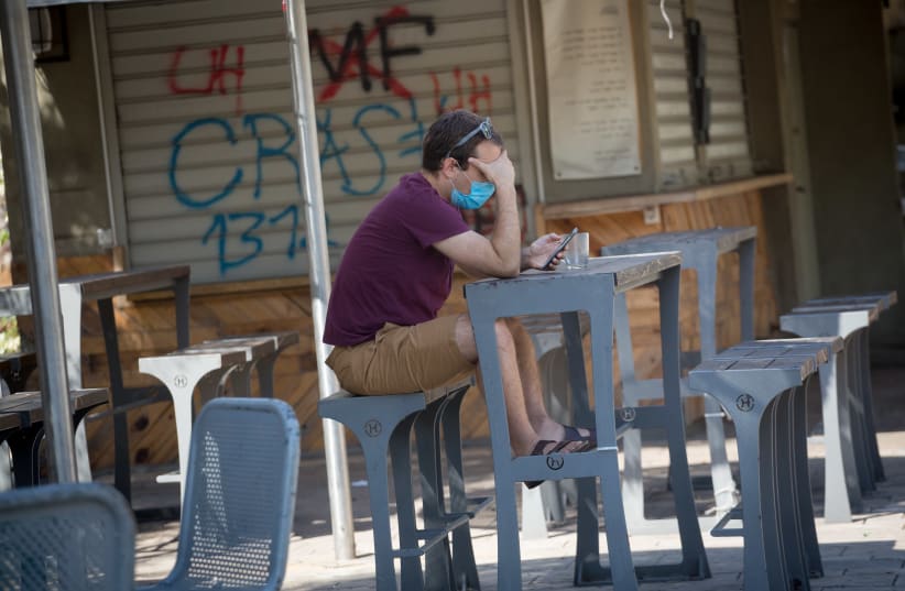 A closed down restaurant in Tel Aviv during a nationwide lockdown. October 14, 2020. (photo credit: MIRIAM ALSTER/FLASH90)