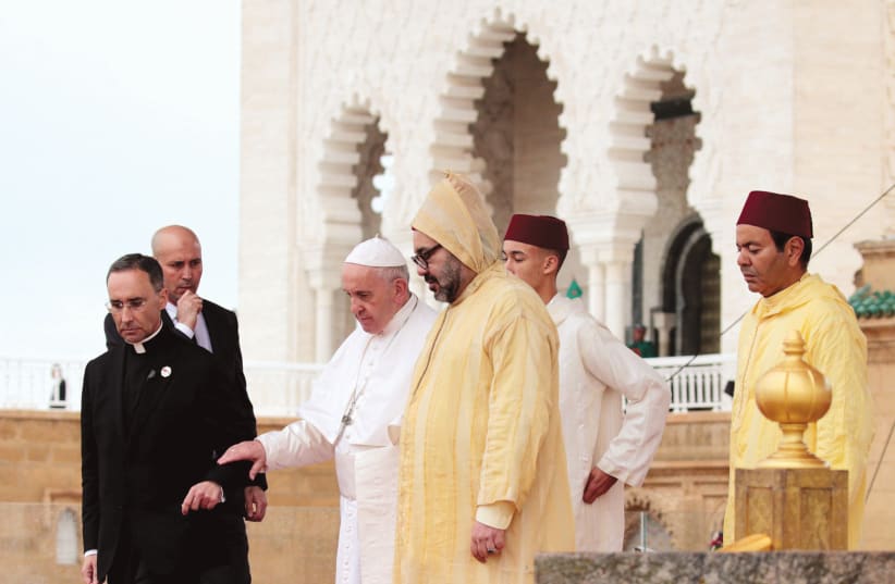 POPE FRANCIS and King Mohammed VI of Morocco visit the Hassan Tower esplanade in Rabat, Morocco, last year. (photo credit: YOUSSEF BOUDLAL / REUTERS)