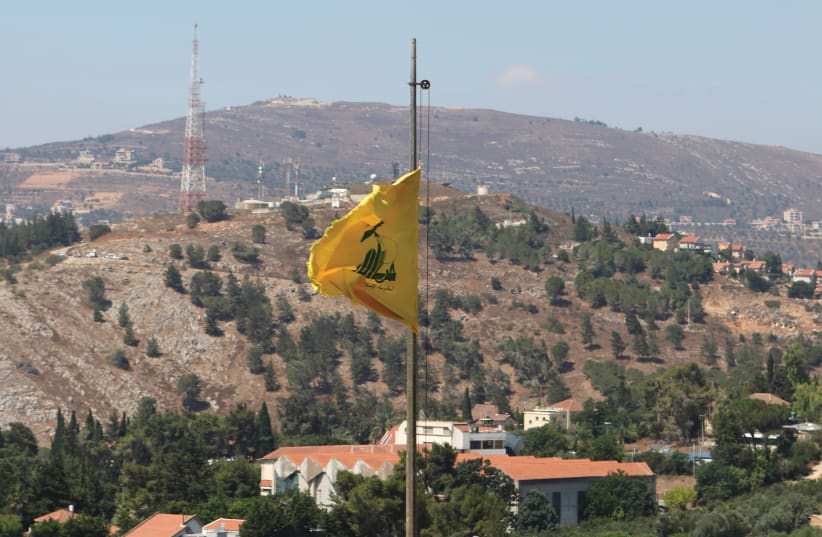 A HEZBOLLAH flag flutters in the breeze of southern Lebanon in August. (photo credit: REUTERS/KARAMALLAH DAHER)