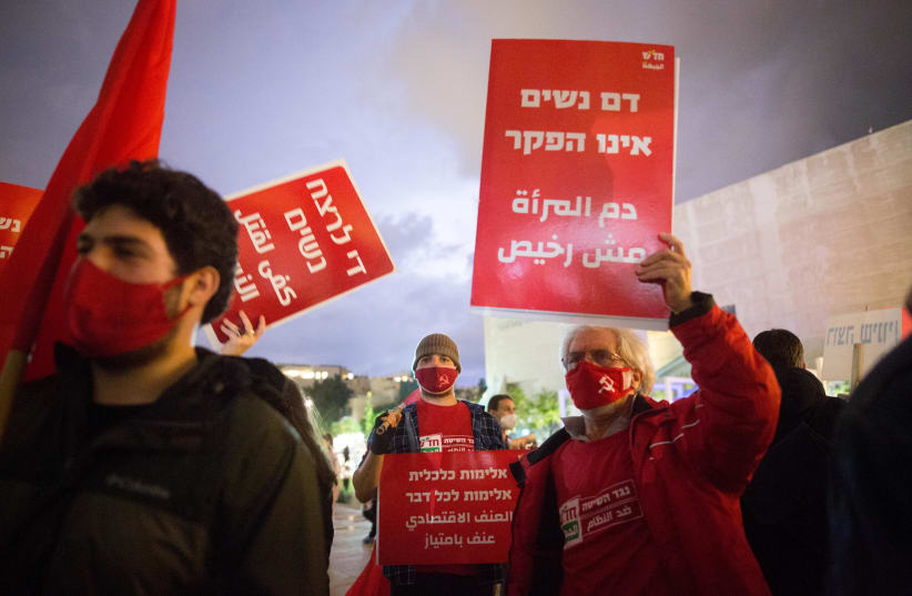 Activists protest against recent cases of violence against women at Habima square in Tel Aviv on November 25, 2020.  (photo credit: MIRIAM ALSTER/FLASH90)